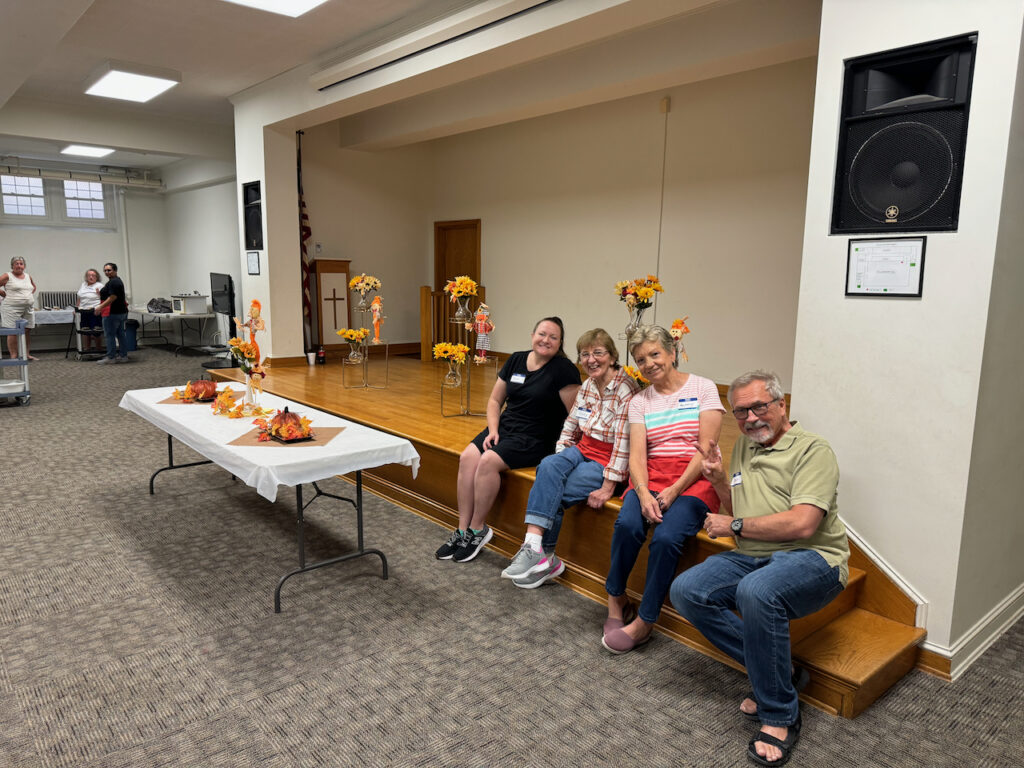 volunteers waiting for patrons at our September 2024 community dinner.